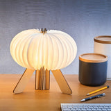 Gingko R Lamp Open on a desk  in Walnut