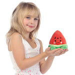 Girl holding Palm Pals Sandy Watermelon Soft Toy