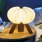 Opened R lamp - illuminated on a bedside table